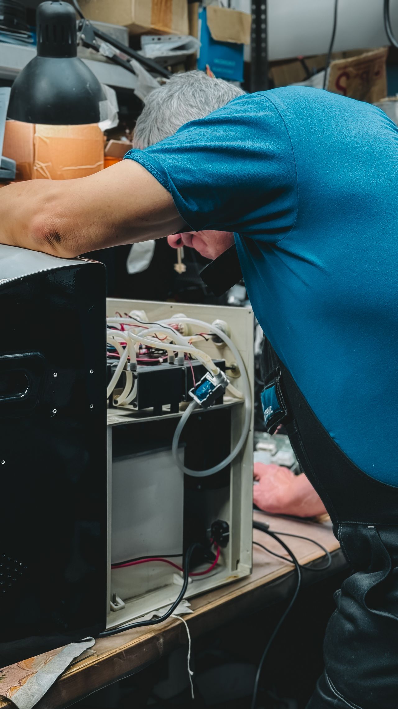 Technician repairing an appliance